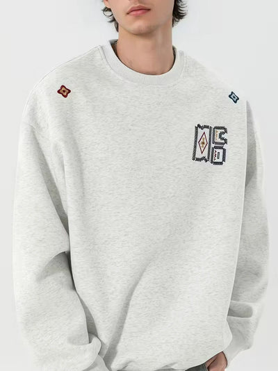Herren Rundhals-Pullover mit Stickapplikationen und Geripptem Saum